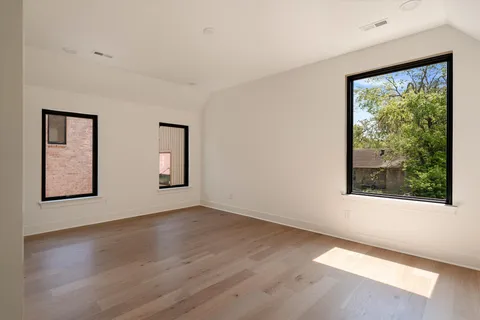 a view of a house with pool and chairs