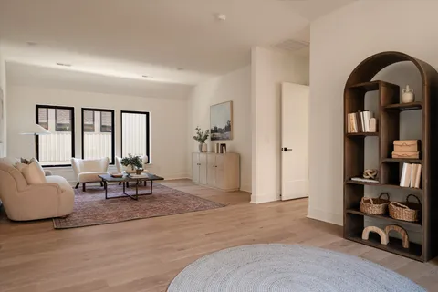 a view of a cafe with a lot of people on a road