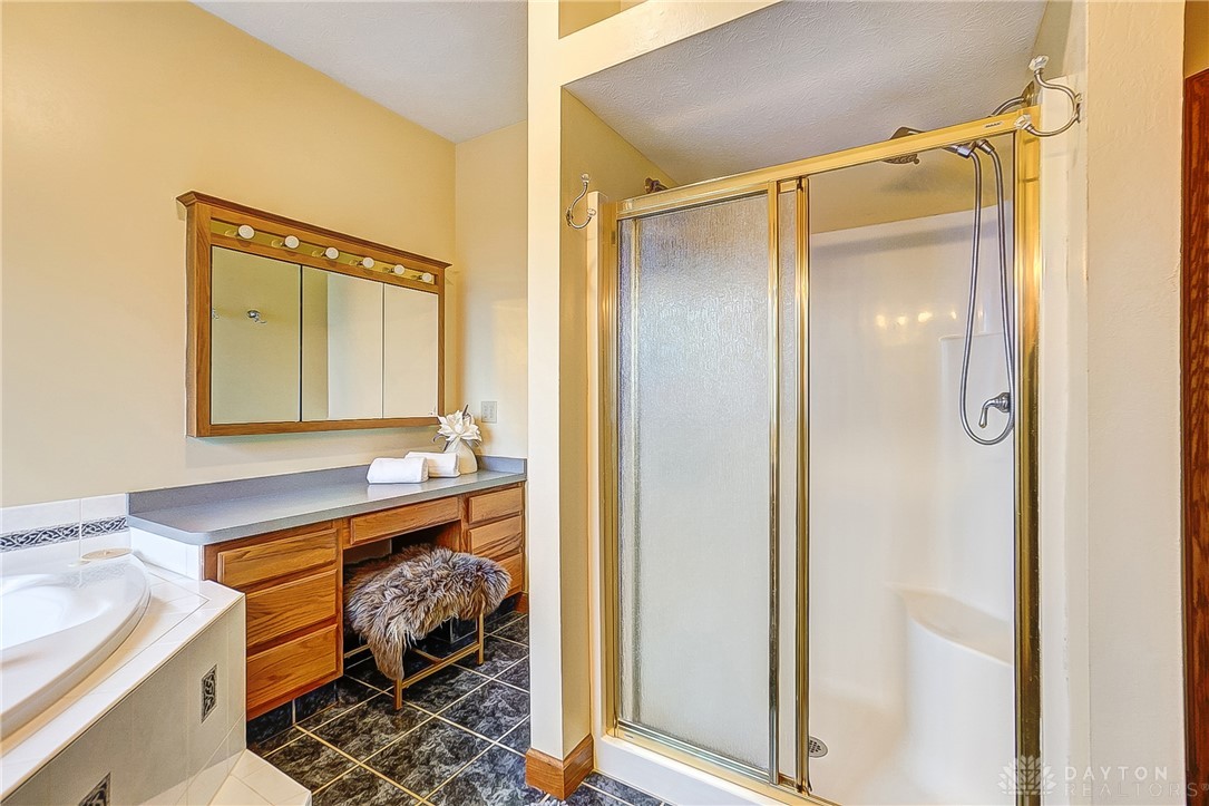 1540 Jasper Road Xenia, OH 45385 - Photo 32 of 91 This bathroom features a functional vanity area and a convenient walk-in shower.