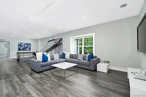 a view of a dining room with furniture and a window