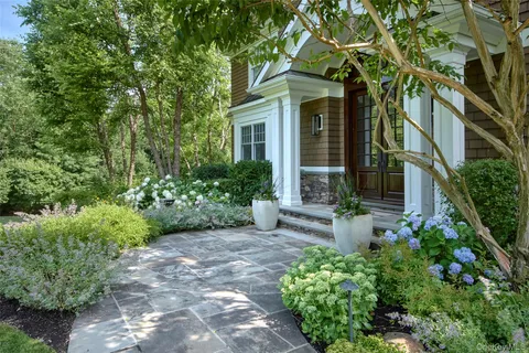 front view of a house with a yard