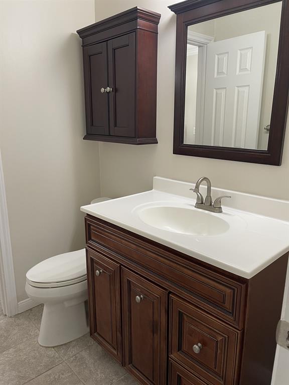 5310 Keller Springs Road, Unit 423 Dallas, TX 75248 - Photo 4 of 7 Bathroom featuring vanity and light tile patterned floors