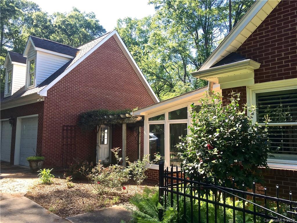 6418 Sardis Road Charlotte, NC 28270 - Photo 3 of 35 a front view of a house with a yard