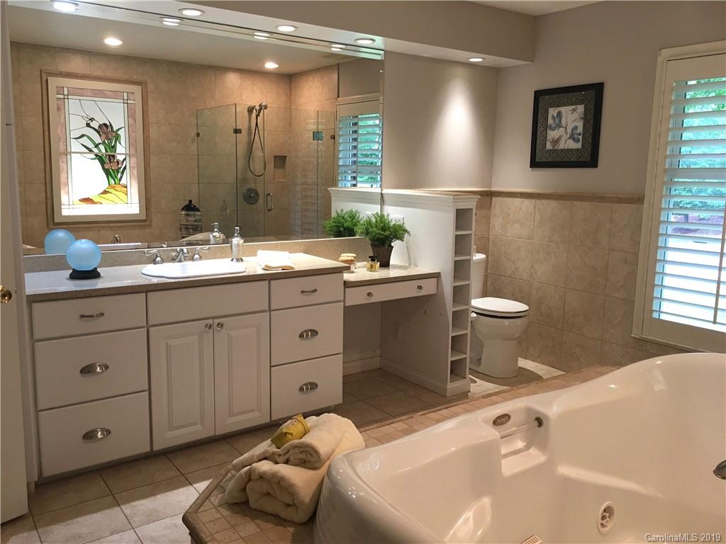 6418 Sardis Road Charlotte, NC 28270 - Photo 23 of 35 a spacious bathroom with a double vanity sink mirror and toilet