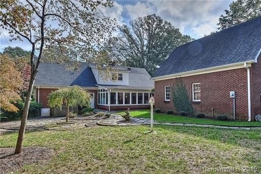 6418 Sardis Road Charlotte, NC 28270 - Photo 4 of 35 a view of a house with backyard and a tree