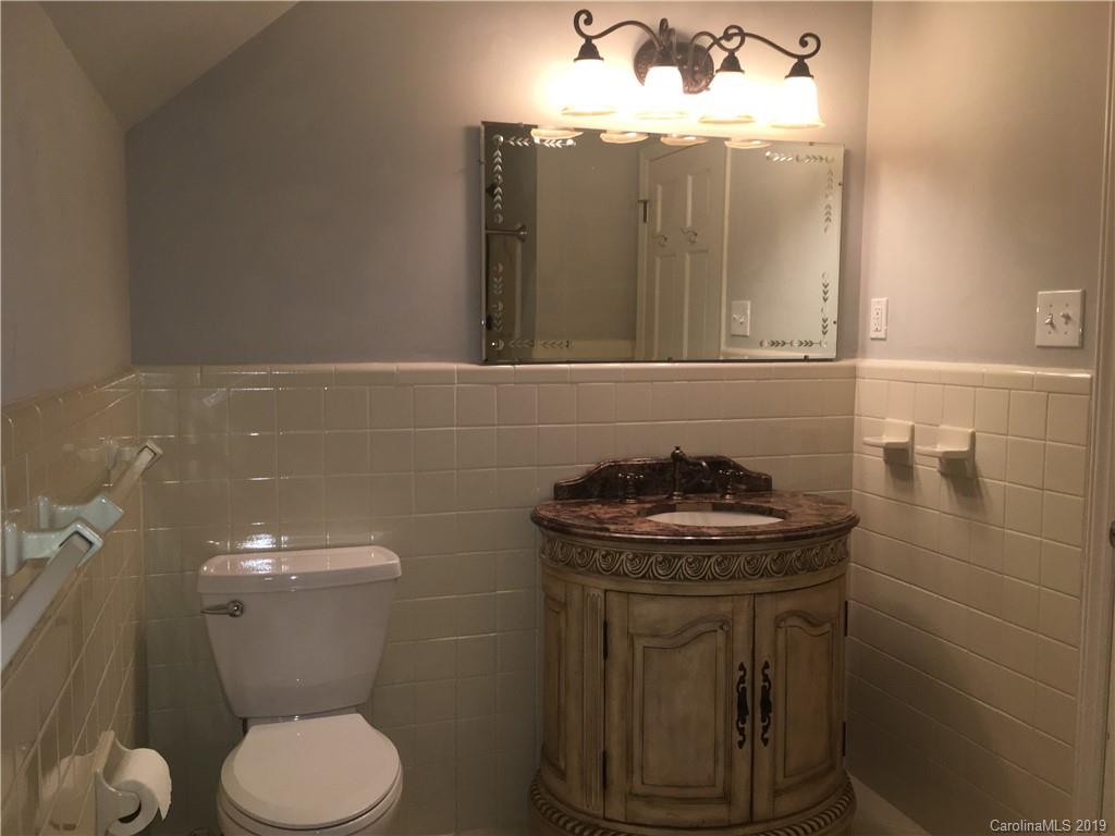 6418 Sardis Road Charlotte, NC 28270 - Photo 35 of 35 a bathroom with a sink a toilet and a mirror