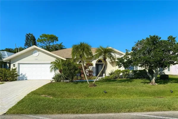 front view of a house with a yard