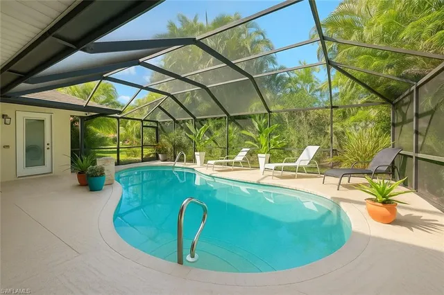 a view of a swimming pool with a patio