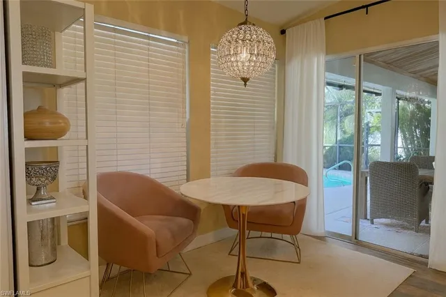 a balcony with table and chairs