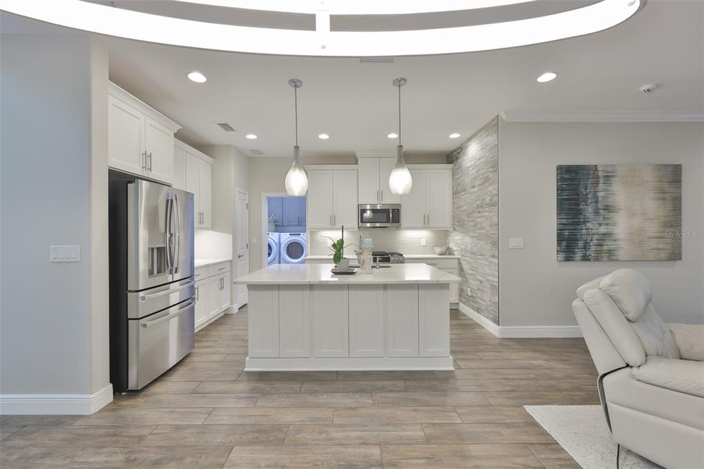 2262 Spring Lake Clearwater, FL 33763 - Photo 12 of 51 a kitchen with stainless steel appliances granite countertop a refrigerator a oven a sink and a refrigerator