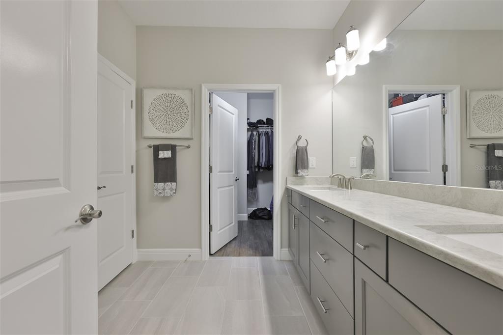 2262 Spring Lake Clearwater, FL 33763 - Photo 21 of 51 a spacious bathroom with a double vanity sink shower and a mirror