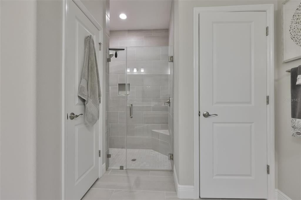 2262 Spring Lake Clearwater, FL 33763 - Photo 22 of 51 a bathroom with a shower and a glass door