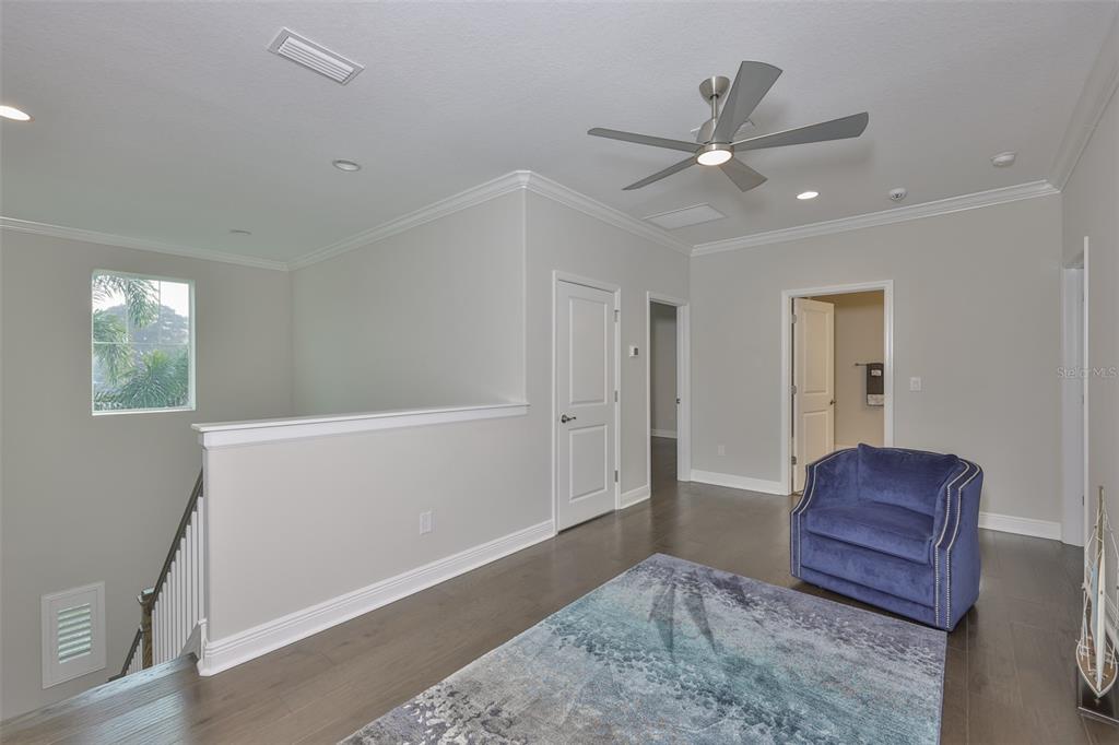 2262 Spring Lake Clearwater, FL 33763 - Photo 26 of 51 a view of livingroom with hardwood floor and ceiling fan