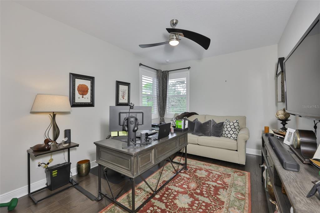 2262 Spring Lake Clearwater, FL 33763 - Photo 29 of 51 a living room with furniture and a wooden floor