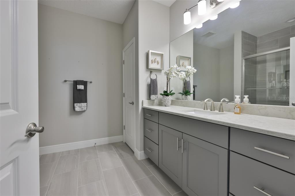 2262 Spring Lake Clearwater, FL 33763 - Photo 32 of 51 a bathroom with a sink and mirror