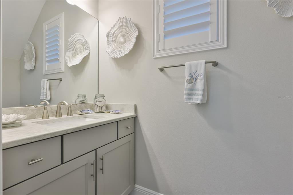 2262 Spring Lake Clearwater, FL 33763 - Photo 33 of 51 a bathroom with a sink and a mirror