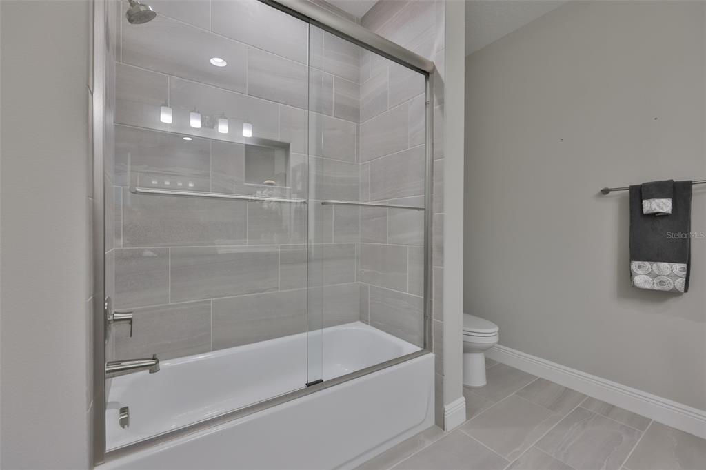 2262 Spring Lake Clearwater, FL 33763 - Photo 34 of 51 a bathroom with a bathtub and a shower