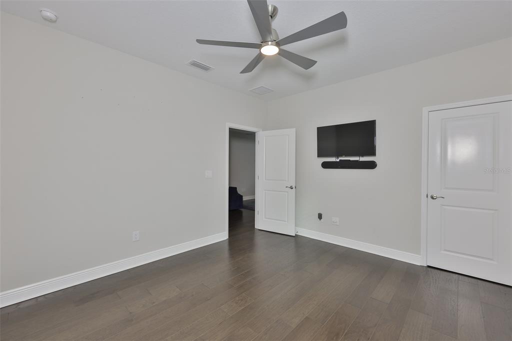 2262 Spring Lake Clearwater, FL 33763 - Photo 35 of 51 an empty room with windows and ceiling fan
