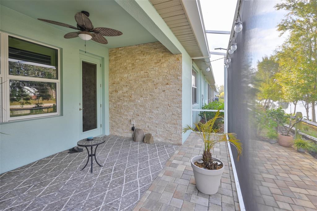 2262 Spring Lake Clearwater, FL 33763 - Photo 40 of 51 a view of a porch with chairs and potted plants