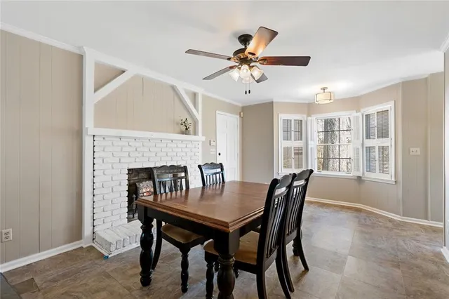 a view of a dining room with furniture and window