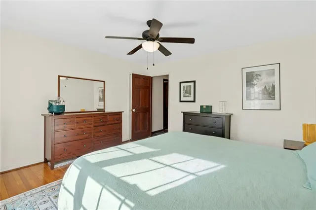 a bedroom with a bed and a dresser