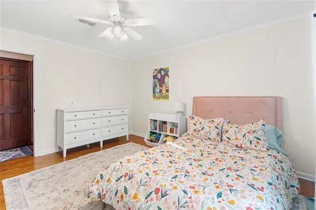 a bed room with a bed and a dresser