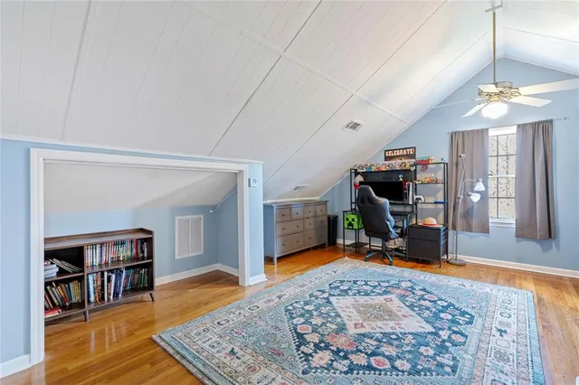a view of a livingroom with furniture and a flat screen tv