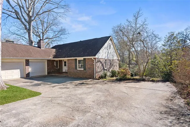 a view of a house with a yard and garage