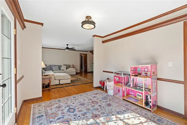 a bedroom with a bed and a dresser in it