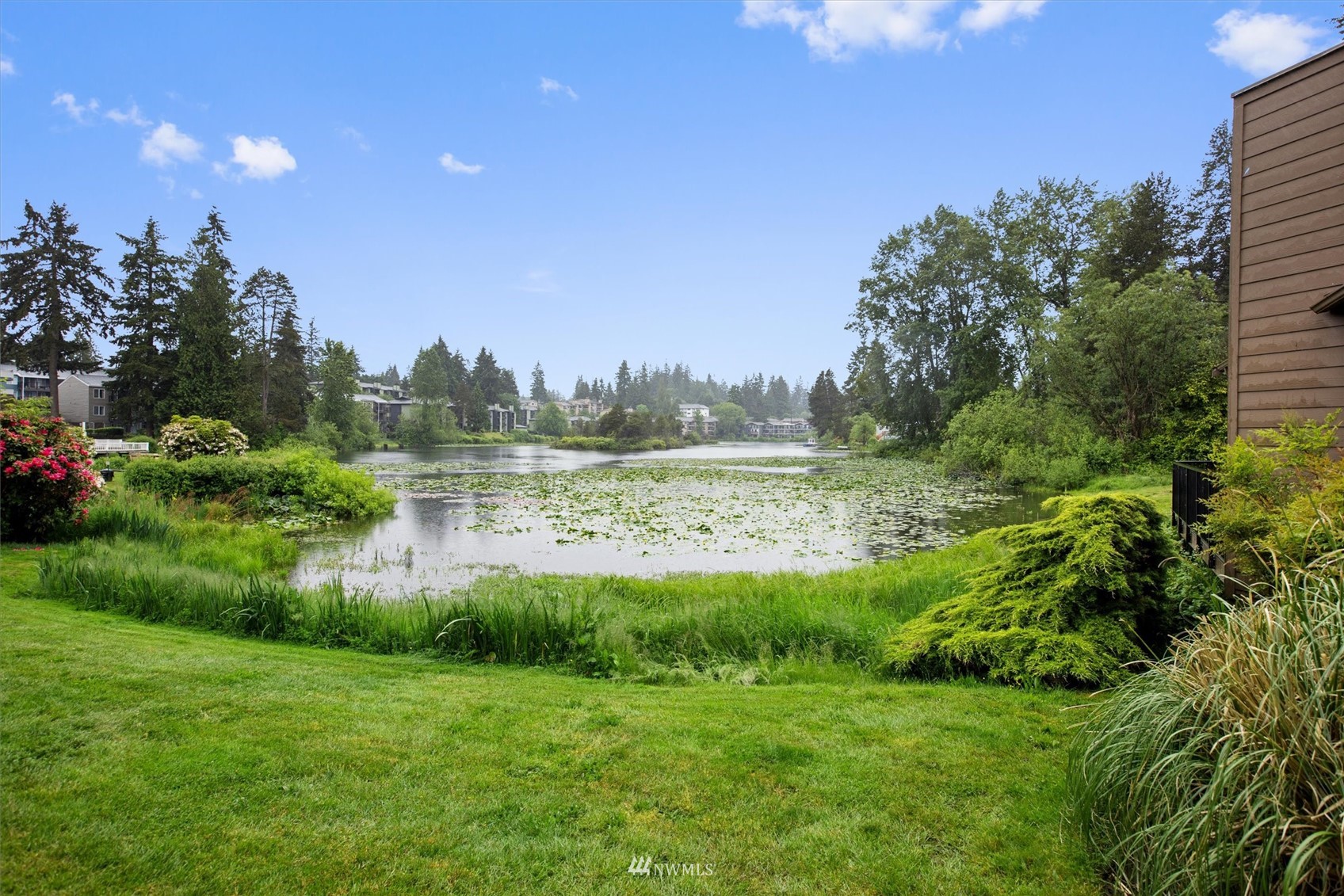 820 Cady Road, Unit D104 Everett, WA 98203 - Photo 24 of 27 a view of a garden with a lake