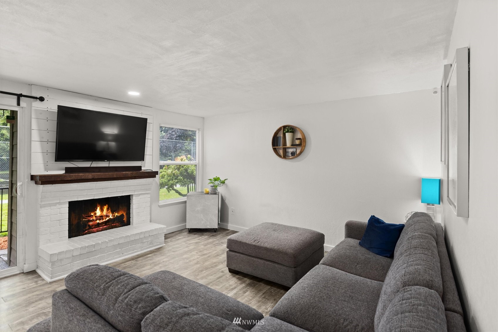820 Cady Road, Unit D104 Everett, WA 98203 - Photo 8 of 27 a living room with furniture and a fireplace