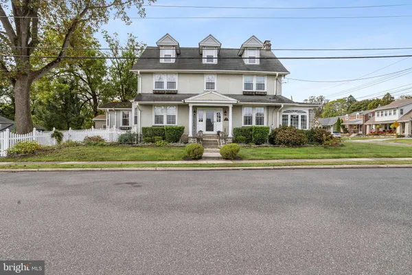 front view of a house with a street