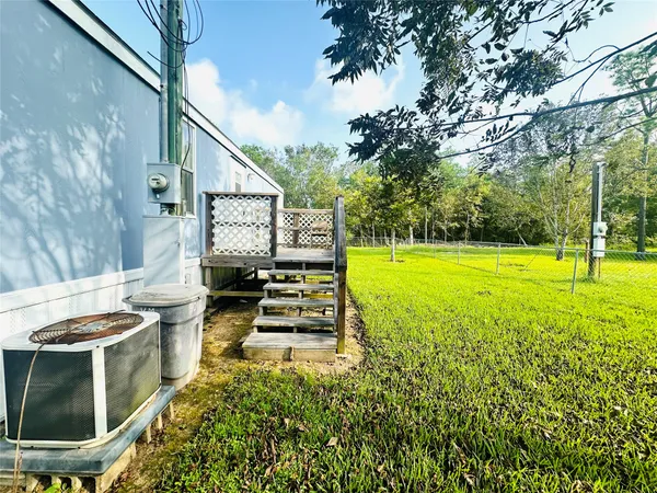 a view of a swimming pool with a yard