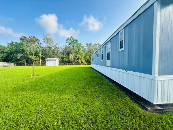 a view of a backyard with garden