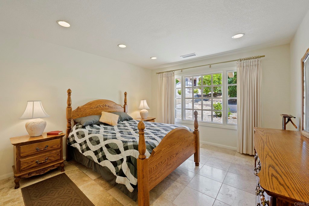 2627 Via Oeste Drive Fallbrook, CA 92028 - Photo 14 of 41 a bedroom with furniture and a window