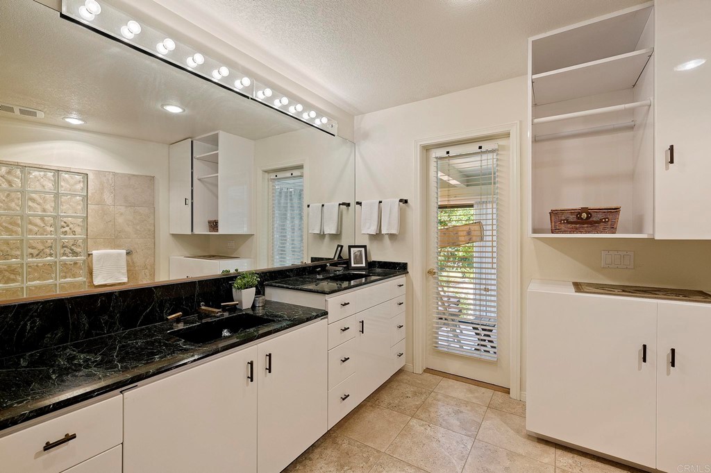 2627 Via Oeste Drive Fallbrook, CA 92028 - Photo 15 of 41 a large kitchen with granite countertop a sink and a stove top oven