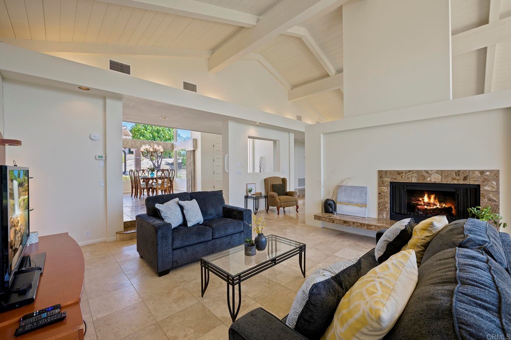 2627 Via Oeste Drive Fallbrook, CA 92028 - Photo 16 of 41 a living room with furniture and a fireplace