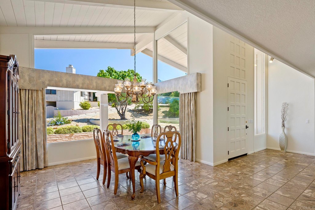 2627 Via Oeste Drive Fallbrook, CA 92028 - Photo 17 of 41 a dining room filled with furniture and window