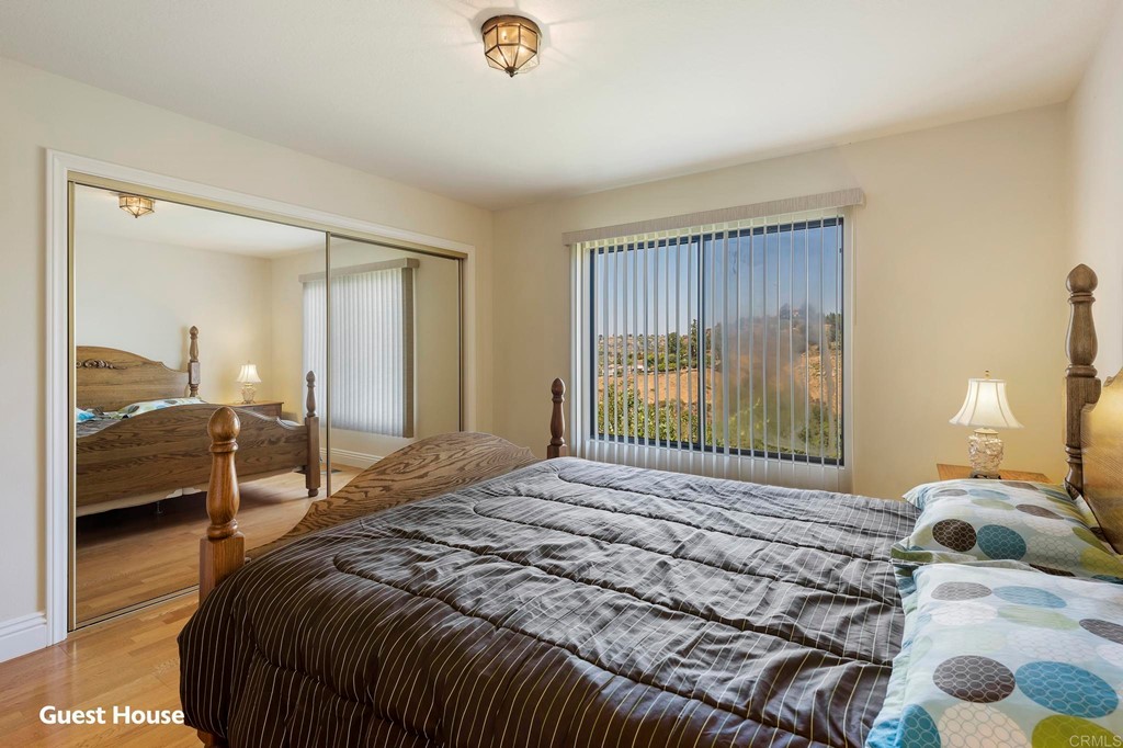 2627 Via Oeste Drive Fallbrook, CA 92028 - Photo 35 of 41 a bedroom with a bed and a large mirror