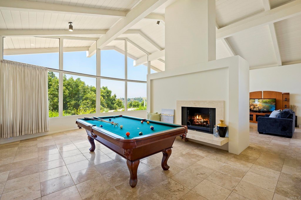 2627 Via Oeste Drive Fallbrook, CA 92028 - Photo 7 of 41 a living room with furniture a rug and a fireplace