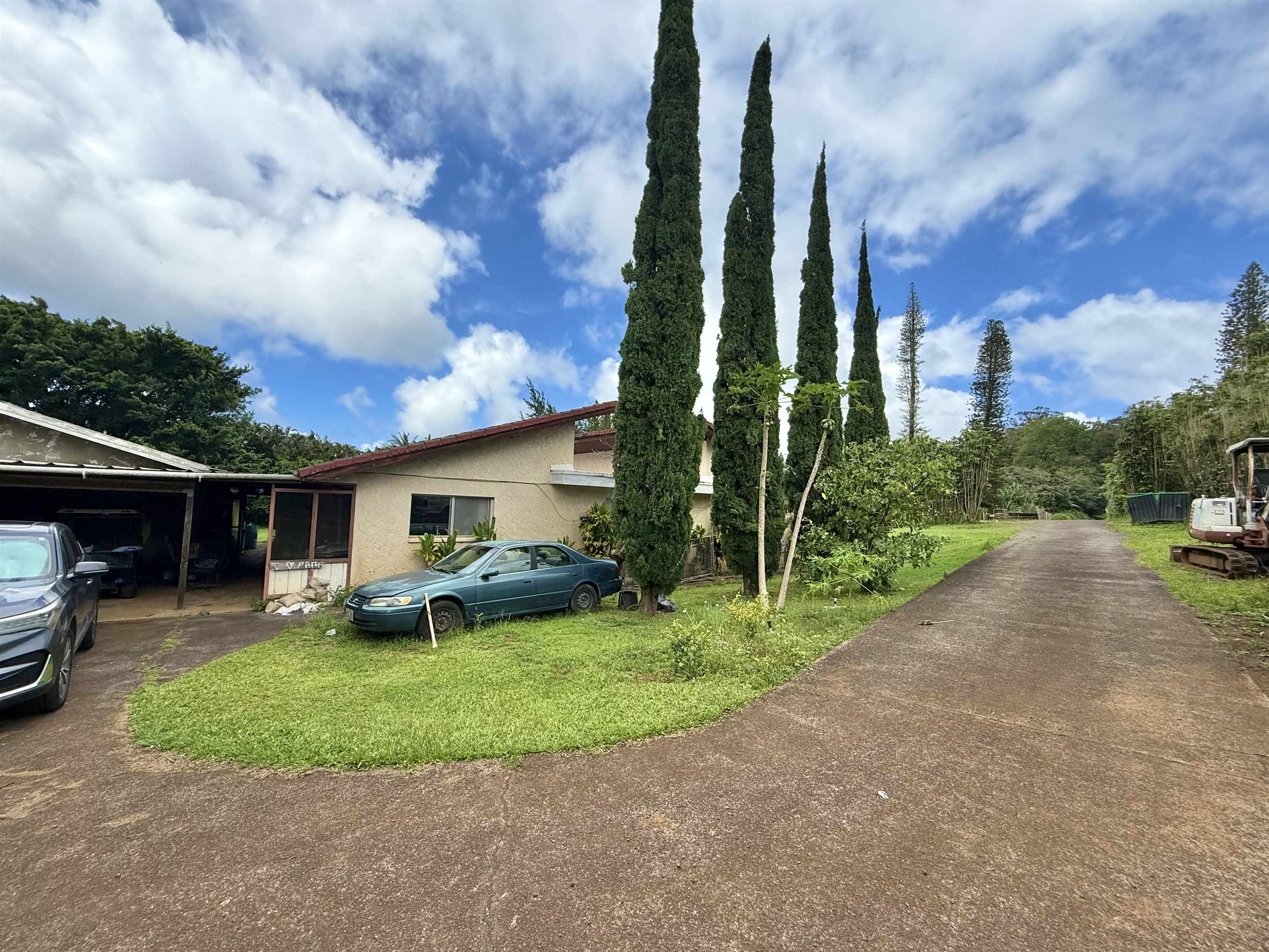 1630 Kauhikoa Road Haiku, HI 96708 - Photo 2 of 48 a view of a backyard with sitting area