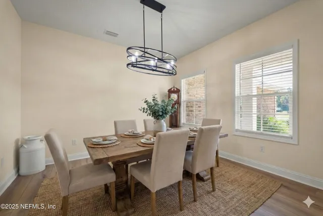 a view of a dining room with furniture window and outside view