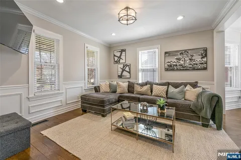 a living room with fireplace furniture and a window