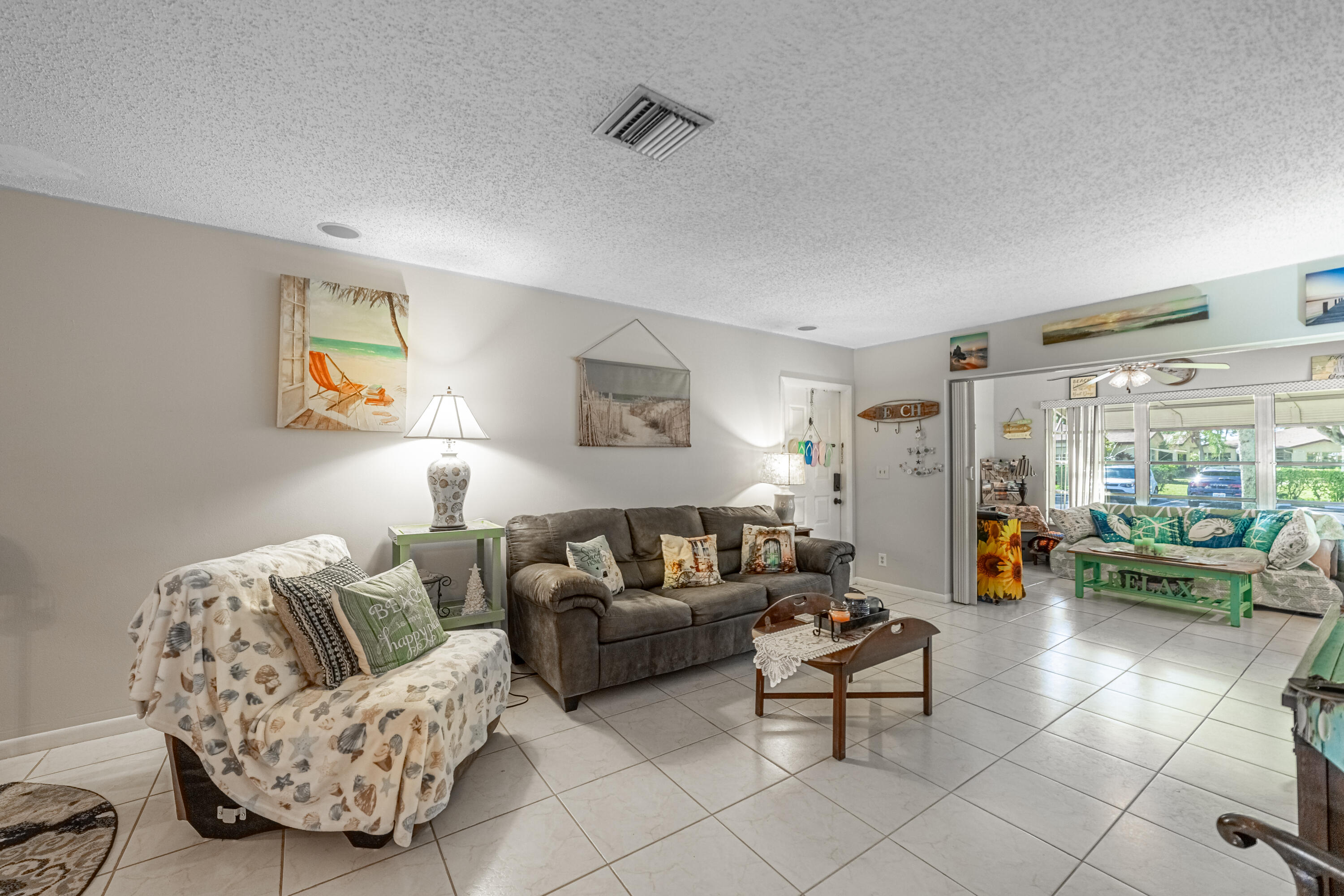 5230 Nesting Way, Unit C Delray Beach, FL 33484 - Photo 9 of 39 Living Room and Den Area