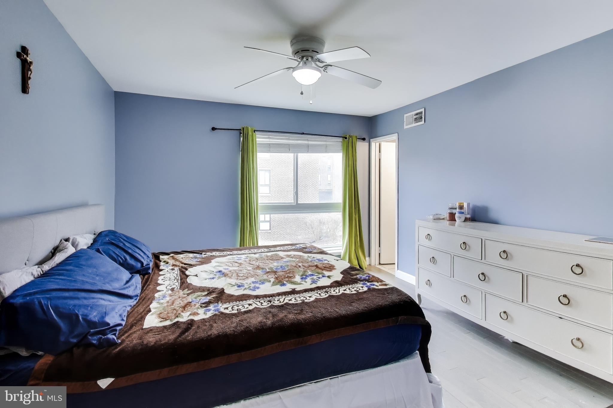 3206 Spartan Road, Unit 17 Olney, MD 20832 - Photo 12 of 28 a bedroom with a bed and a dresser