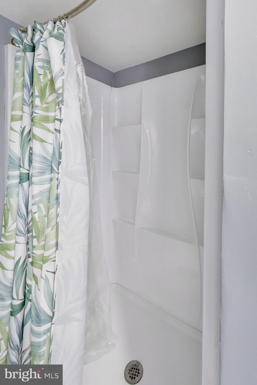 3206 Spartan Road, Unit 17 Olney, MD 20832 - Photo 15 of 28 a bathroom with a shower curtain and a shower curtain