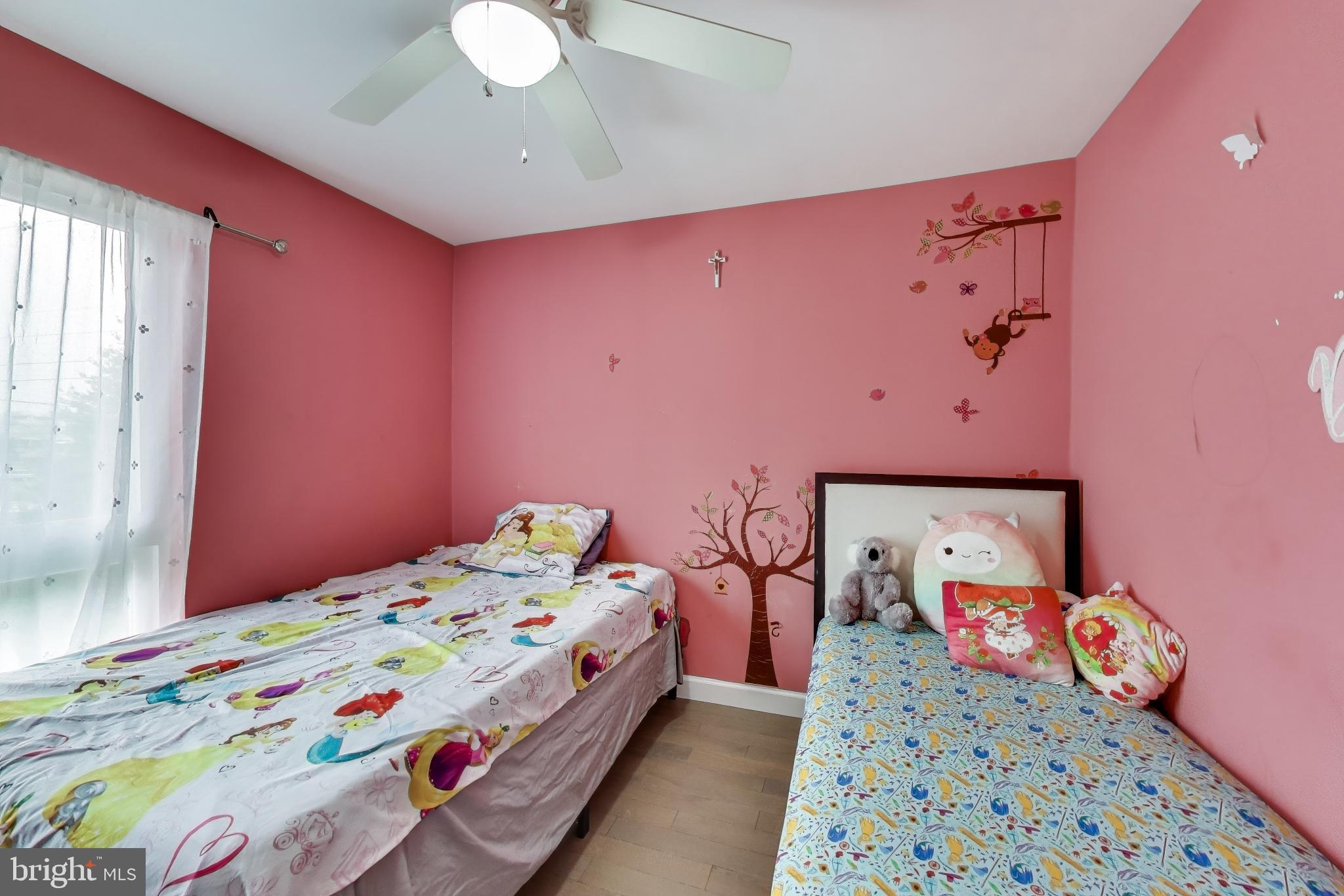 3206 Spartan Road, Unit 17 Olney, MD 20832 - Photo 16 of 28 a bedroom with a bed and a chandelier