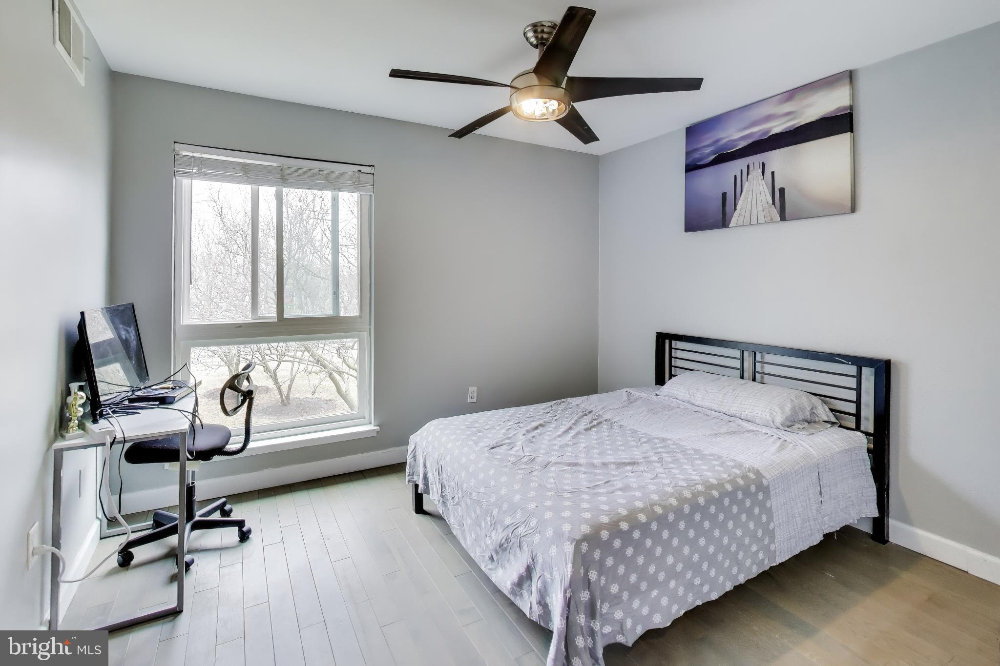 3206 Spartan Road, Unit 17 Olney, MD 20832 - Photo 17 of 28 a bedroom with a bed and a chair