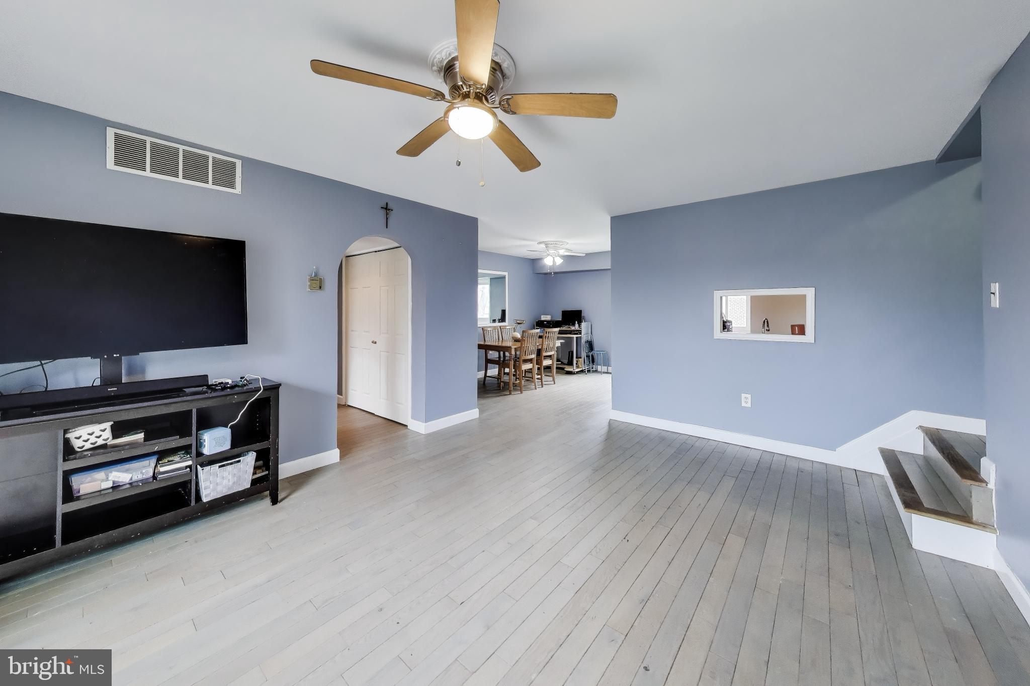 3206 Spartan Road, Unit 17 Olney, MD 20832 - Photo 6 of 28 a living room with furniture and a flat screen tv