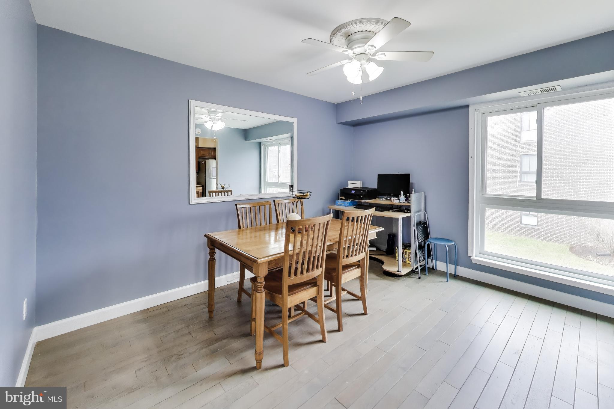 3206 Spartan Road, Unit 17 Olney, MD 20832 - Photo 7 of 28 a workspace with wooden floor and a window